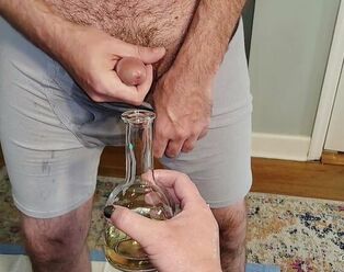 Urinate and spunk experiment with a bottle
